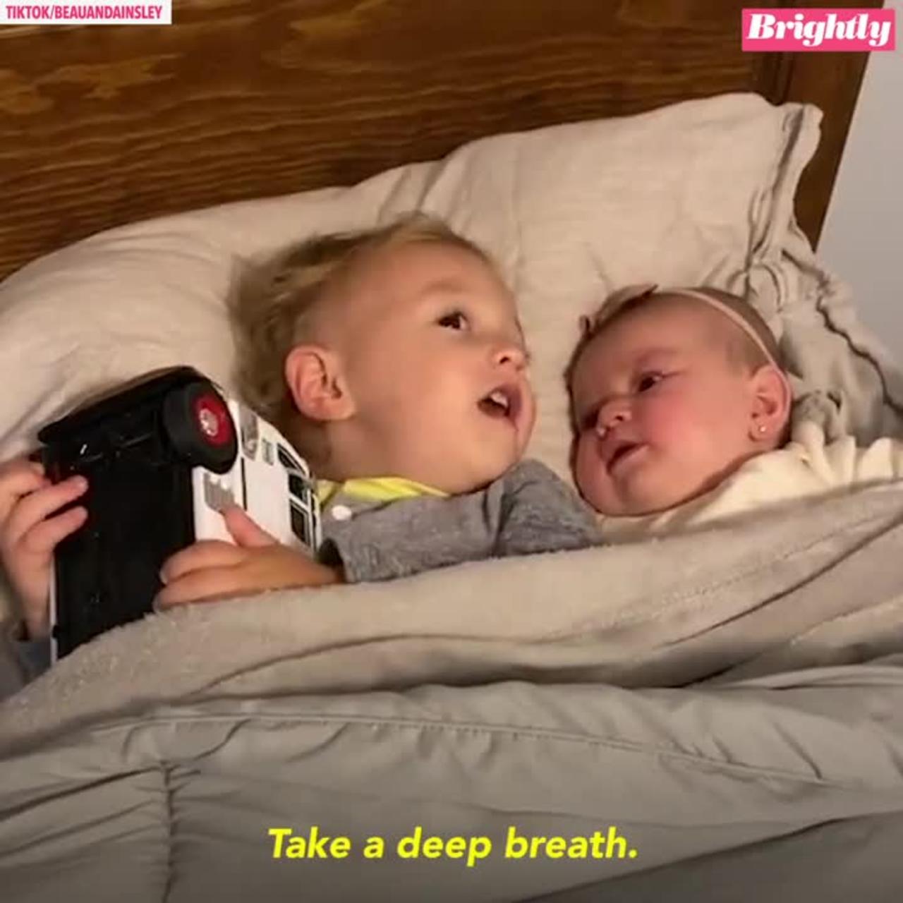 calms baby sister in viral video