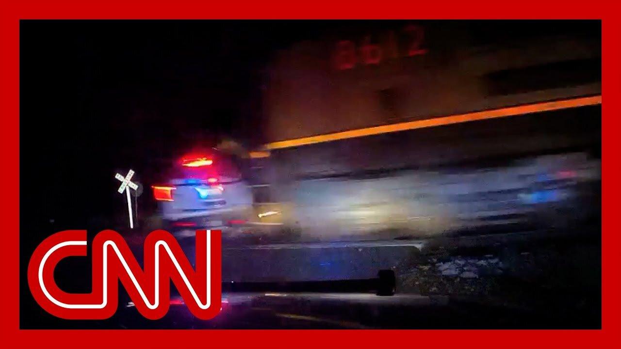 Train hits police vehicle with suspect inside - CNN