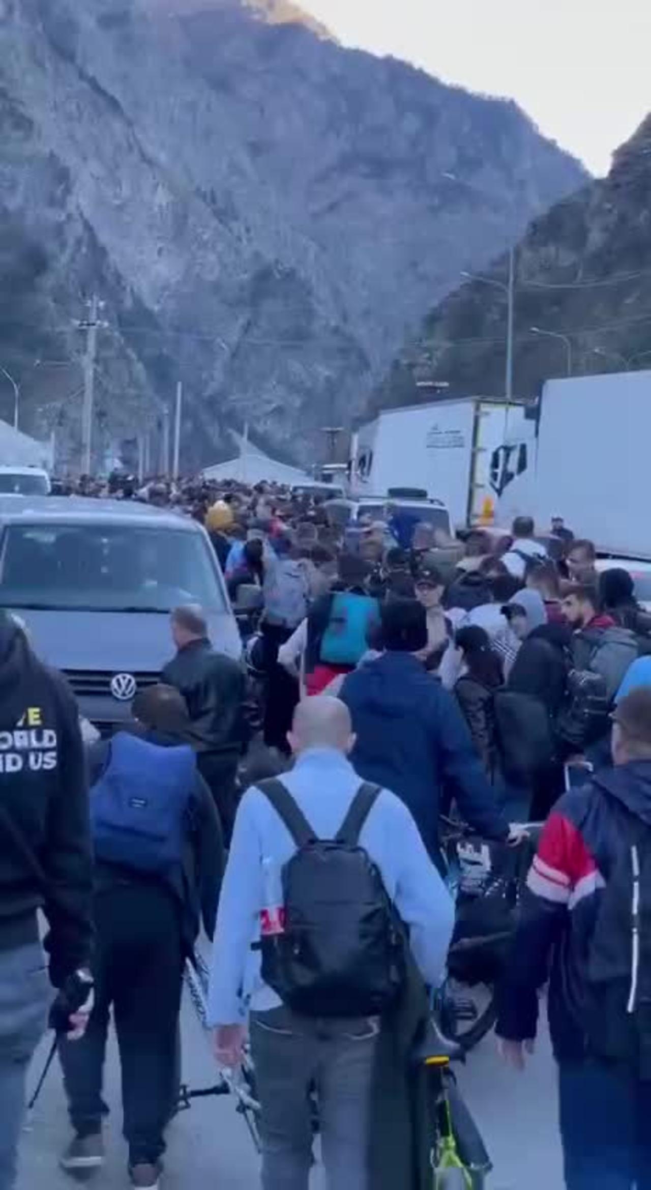 Russians trying to leave for Georgia were allowed to cross the border on foot.