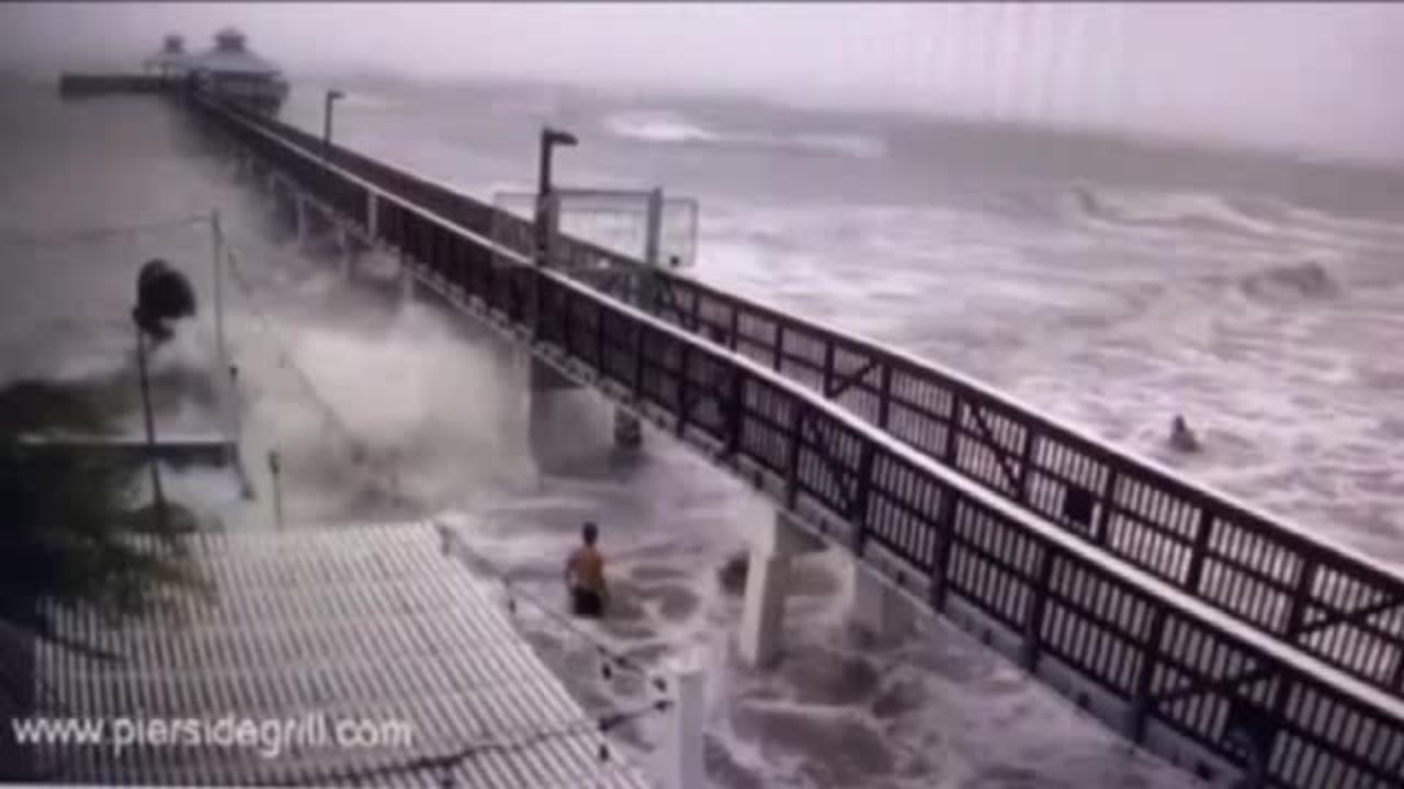 Fort Myers, FL shows swimmers getting into the storm surge as Hurricane Ian approaches.