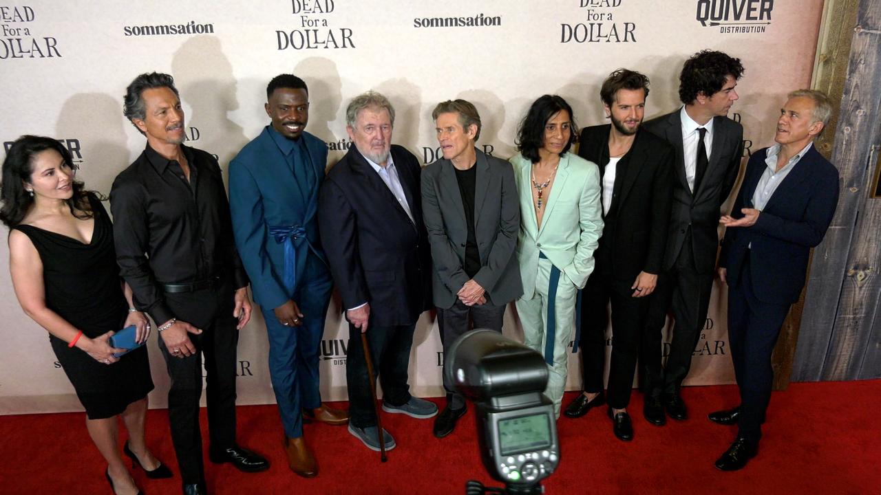 Cast of 'Dead For A Dollar' pose on the red carpet at their premiere screening in Los Angeles