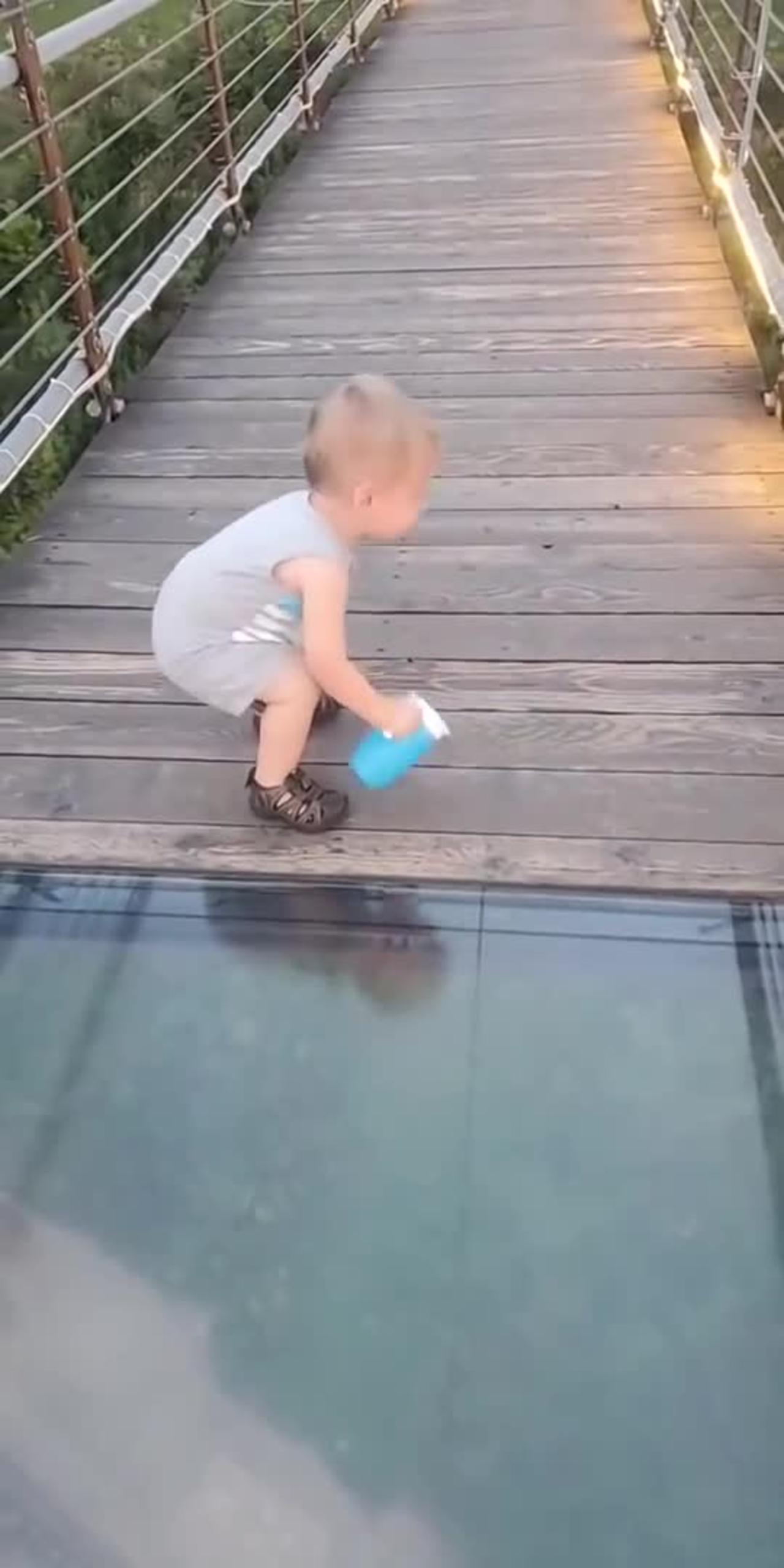 The kid is trying to cross the Glass Bridge