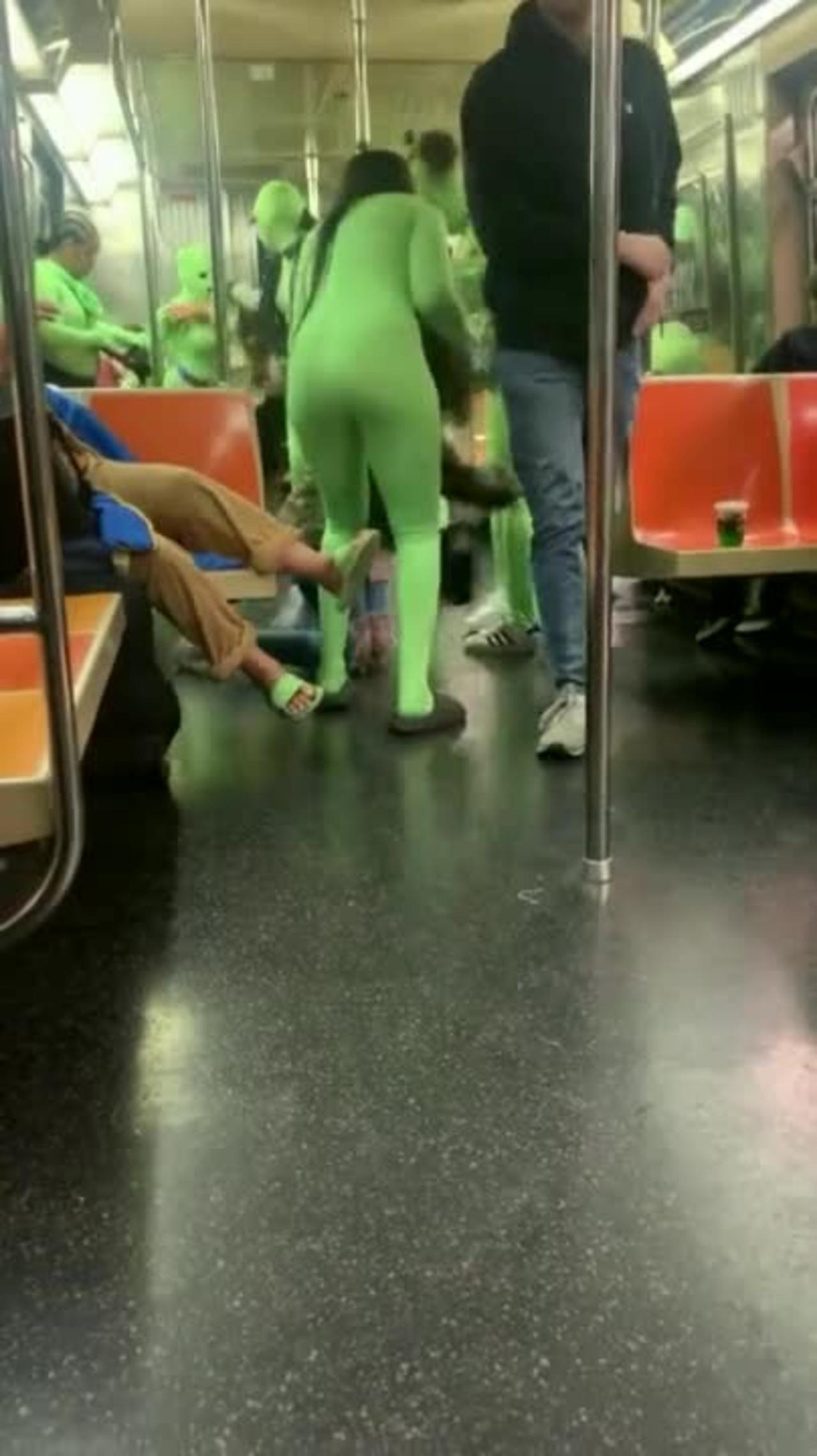 Horde Of Women In Neon Green Bodysuits Assault NYC Subway Passengers