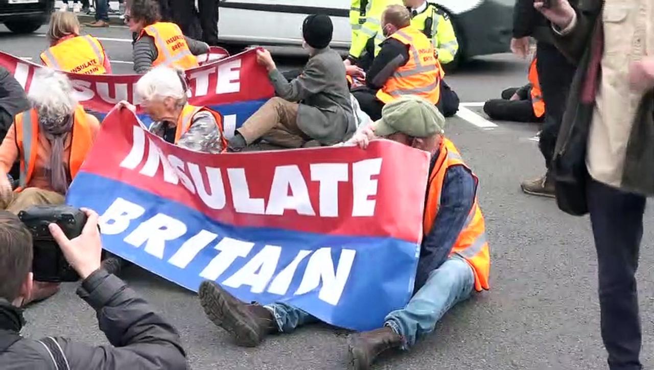 Insulate Britain block road outside Houses of Parliament