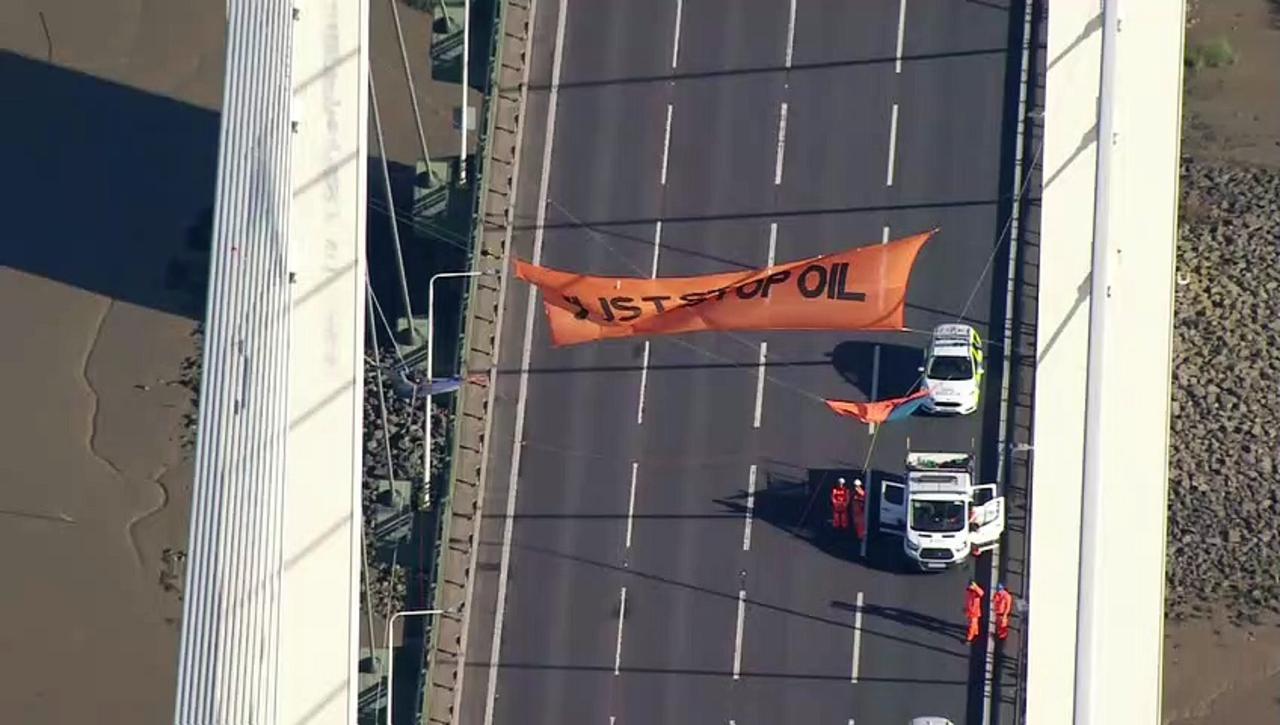 Just Stop Oil protesters suspend themselves from bridge