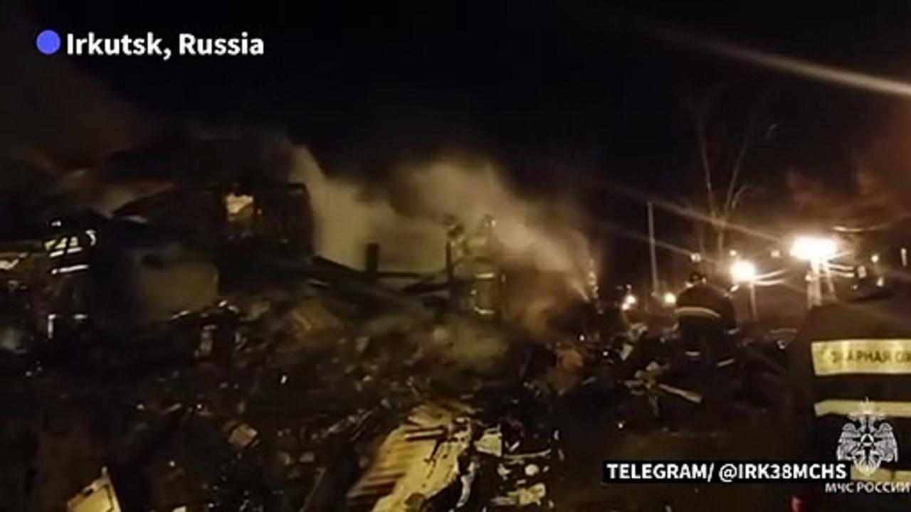 Russian military jet crashes into building in southern Siberia