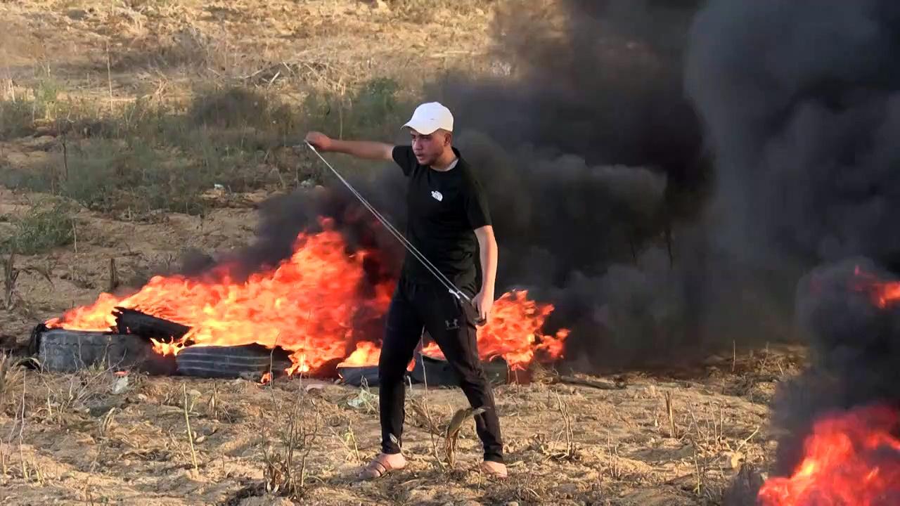 Palestinians burn tyres and hurl stones across Israel border east of Gaza City
