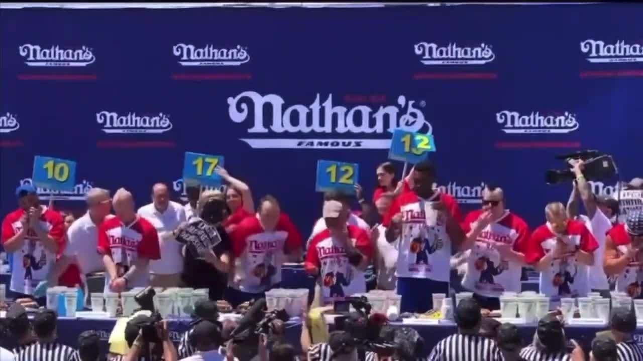 Mid-Competition Joey Chestnut Takes Down Protester!
