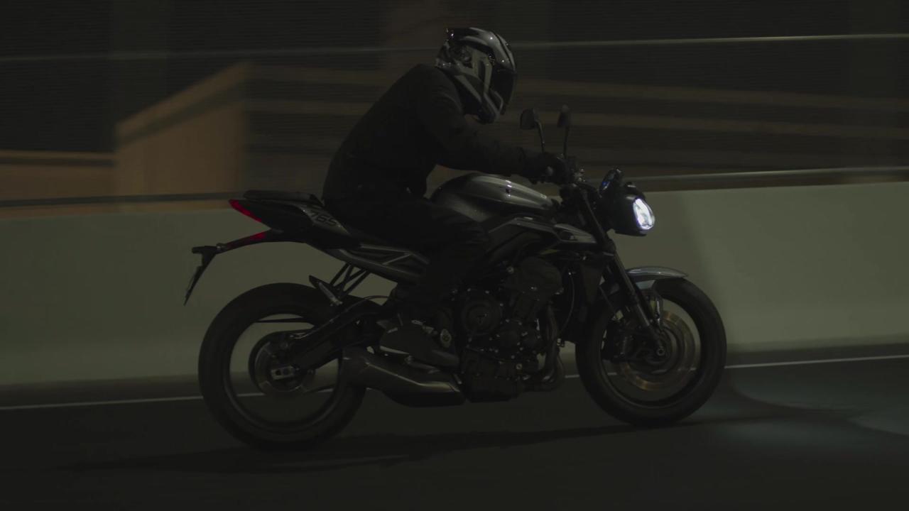 The new Triumph Street Triple R Driving in the city