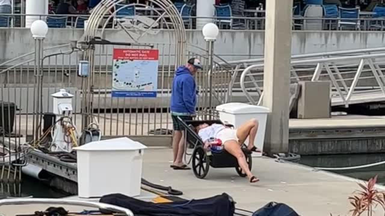 Woman at the Docks Gets Pulled Along in Cart