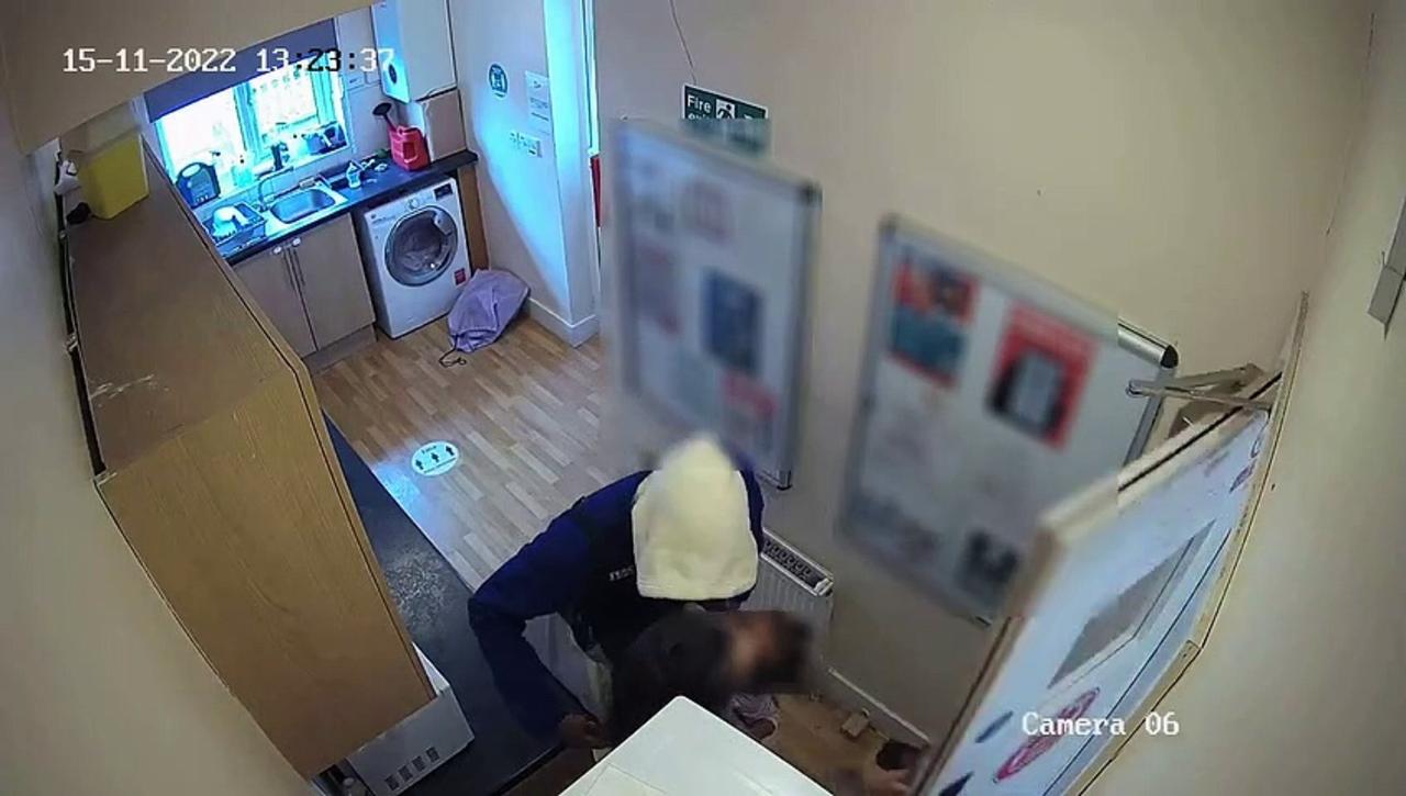 Terrifying CCTV shows knifemen rob woman in own home