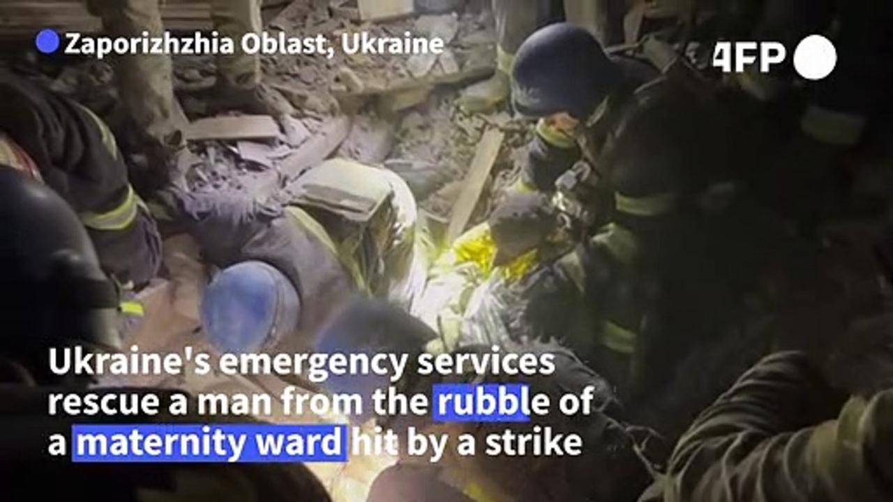 Ukrainian emergency services rescue man from rubble of shelled maternity ward