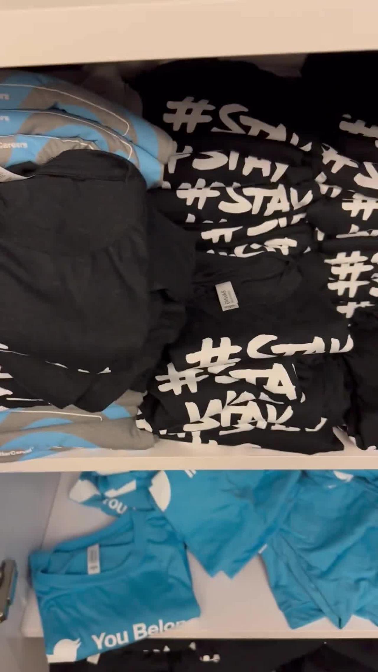 TWEET SHIRTS: Watch Musk Uncover Closet Filled With '#StayWoke' T-Shirts at Twitter HQ