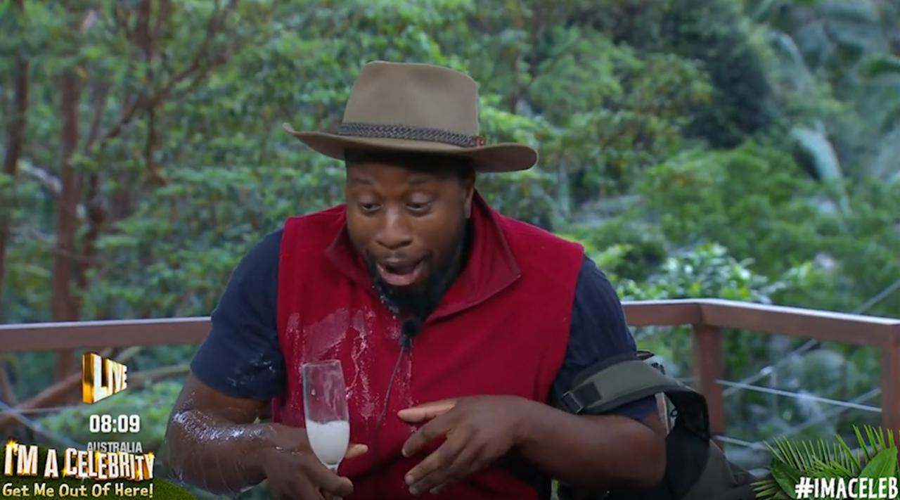 Babatunde Aléshé spills his drink during I'm A Celebrity exit interview