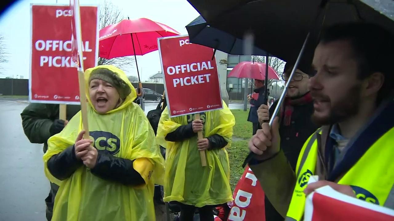 Border Force staff take to the picket line outside Heathrow