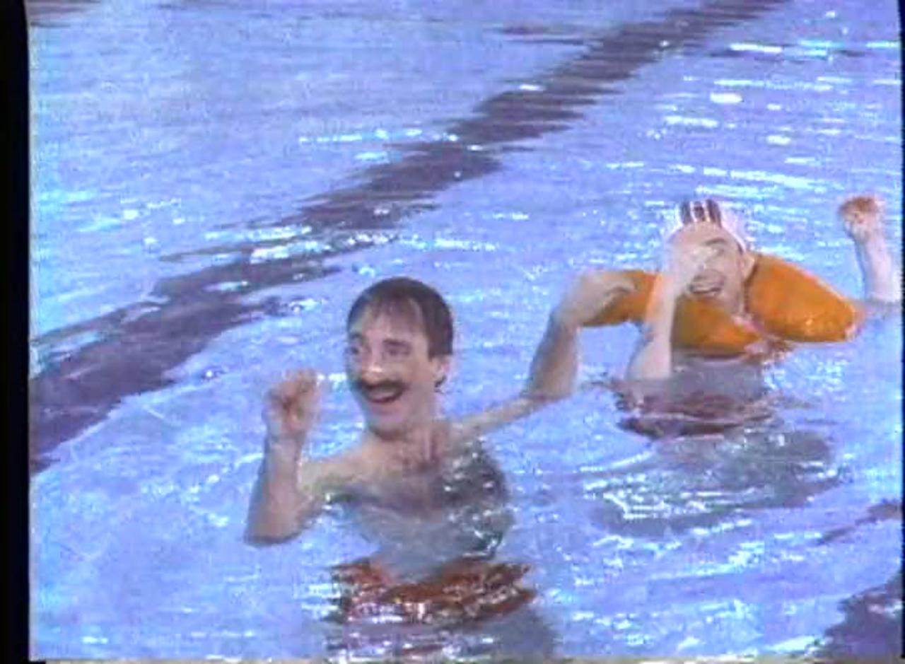 SNL sketch ‘Synchronized Swimming’ from 1984 with Harry Shearer, Martin Short, and Christopher Guest