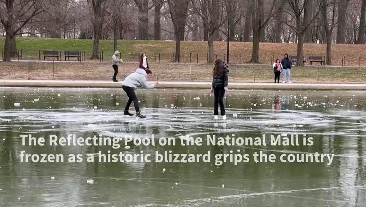 Reflecting Pool covered with ice on National Mall in US capital