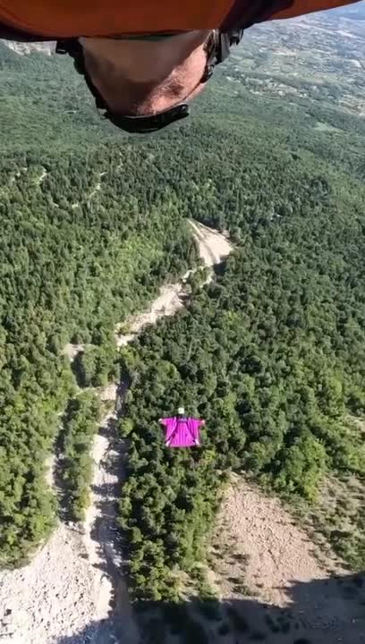 Couple Base Jumps While Dressed in Wingsuits
