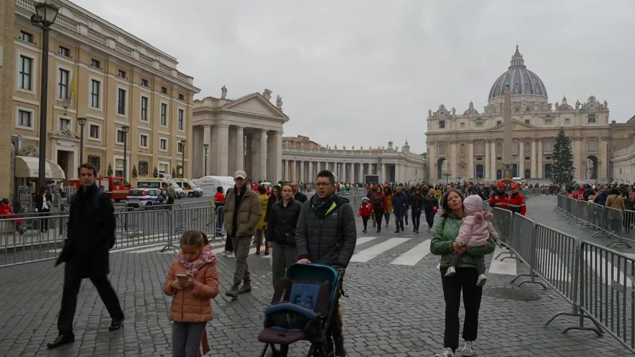 People line up at St. Peter’s Basilica to pay respects to Pope Benedict