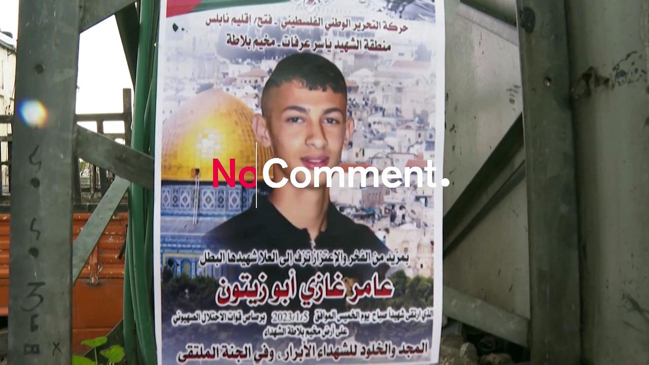 Mourners carry flag-draped body of 16-year-old Palestinian killed by Israeli forces