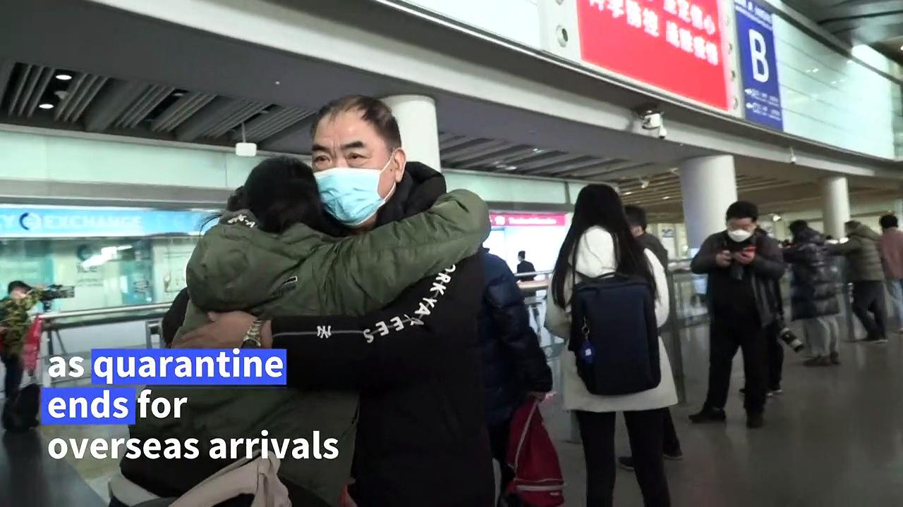 Elation at Beijing airport as China ends quarantine for overseas travellers