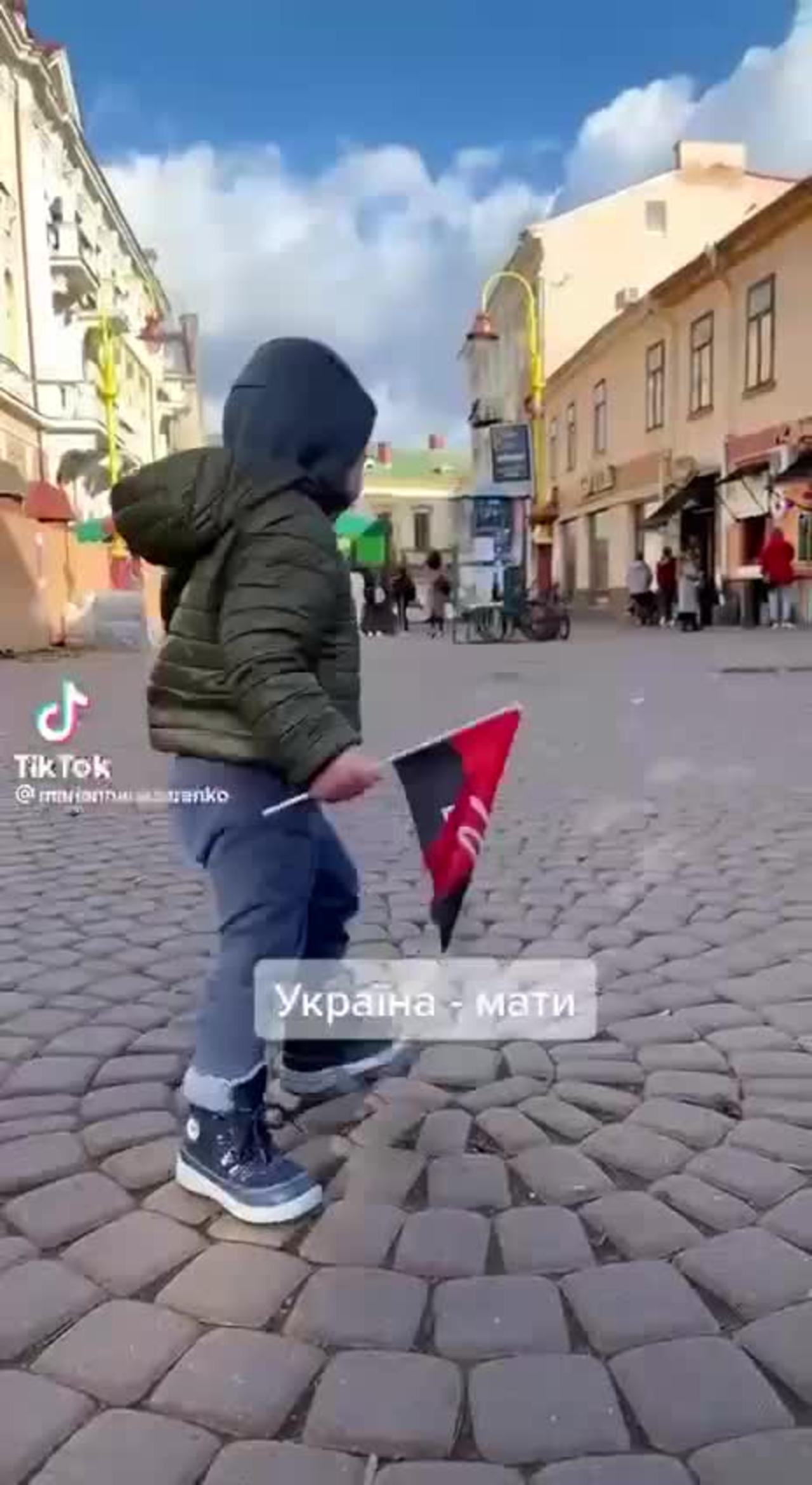 Ukrainian child singing a song to the memory of Nazi