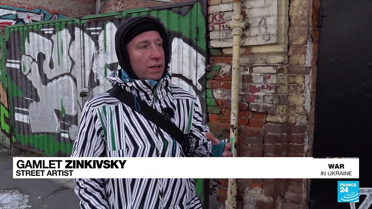 Ukraine’s local “Banksy” paints his native, partly destroyed Kharkiv