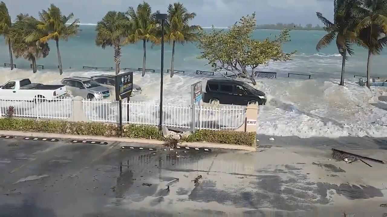 Large Wave Floods Street and Parking Lot in Nassau, Bahamas