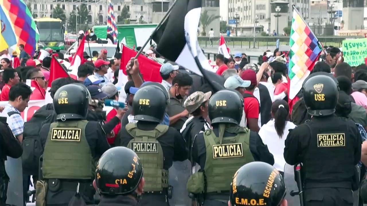 Political protests in Peru as rival groups march through the capital city Lima