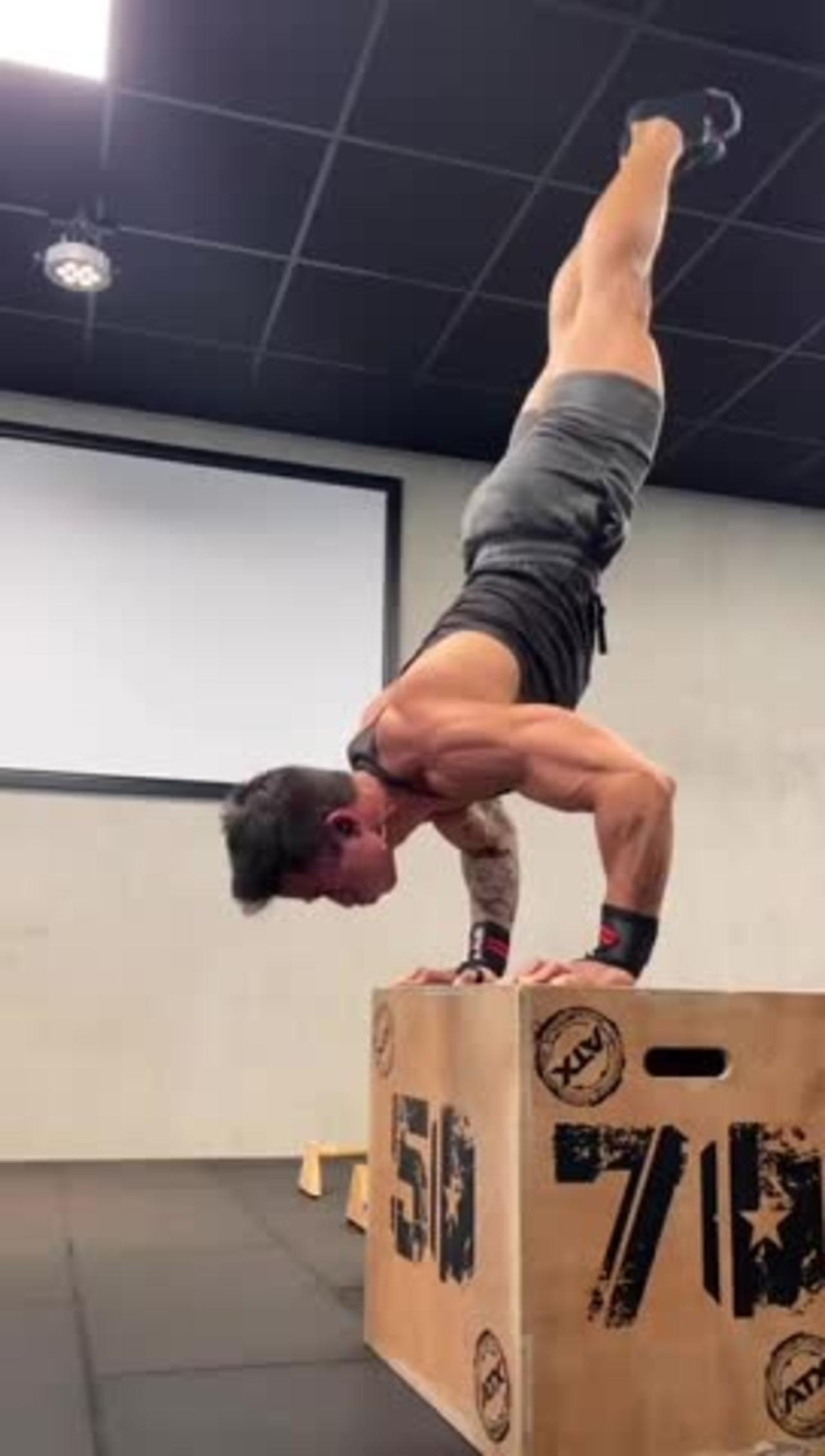 Guy Does Handstand PushUps on Three Different One News Page VIDEO