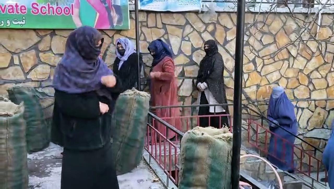 Afghans receive aid packages in Kabul
