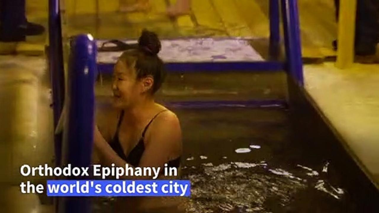 Residents in the world's coldest city take icy plunge to celebrate Epiphany
