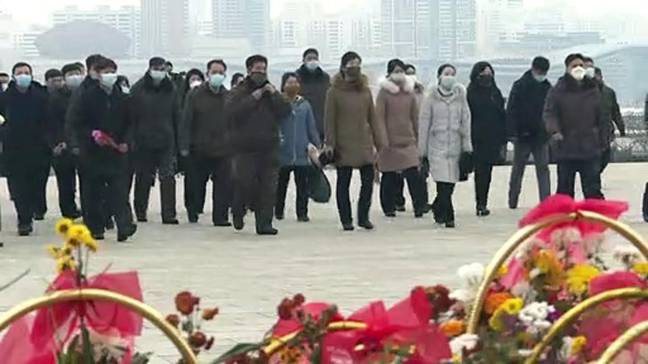 North Koreans lay flowers for Lunar New Year