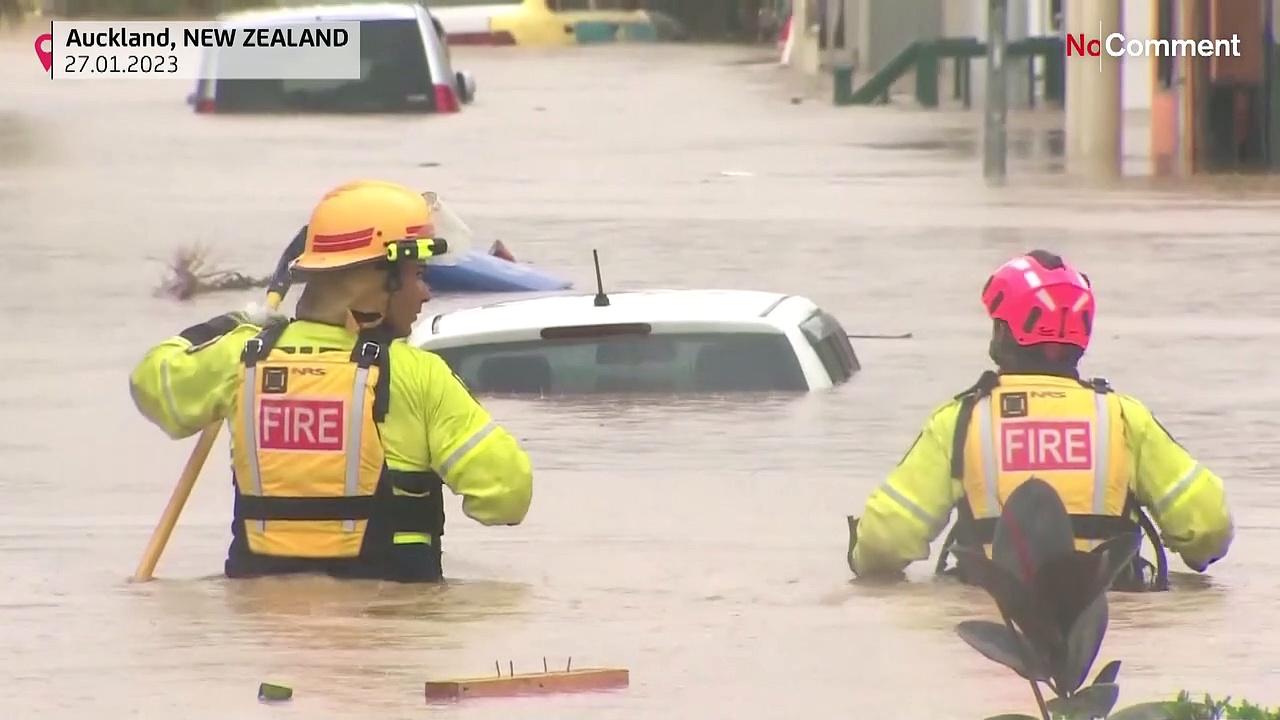 Watch: New Zealanders wade through floodwaters as wild weather continues