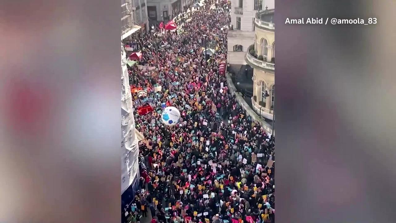 Thousands of striking workers march through London