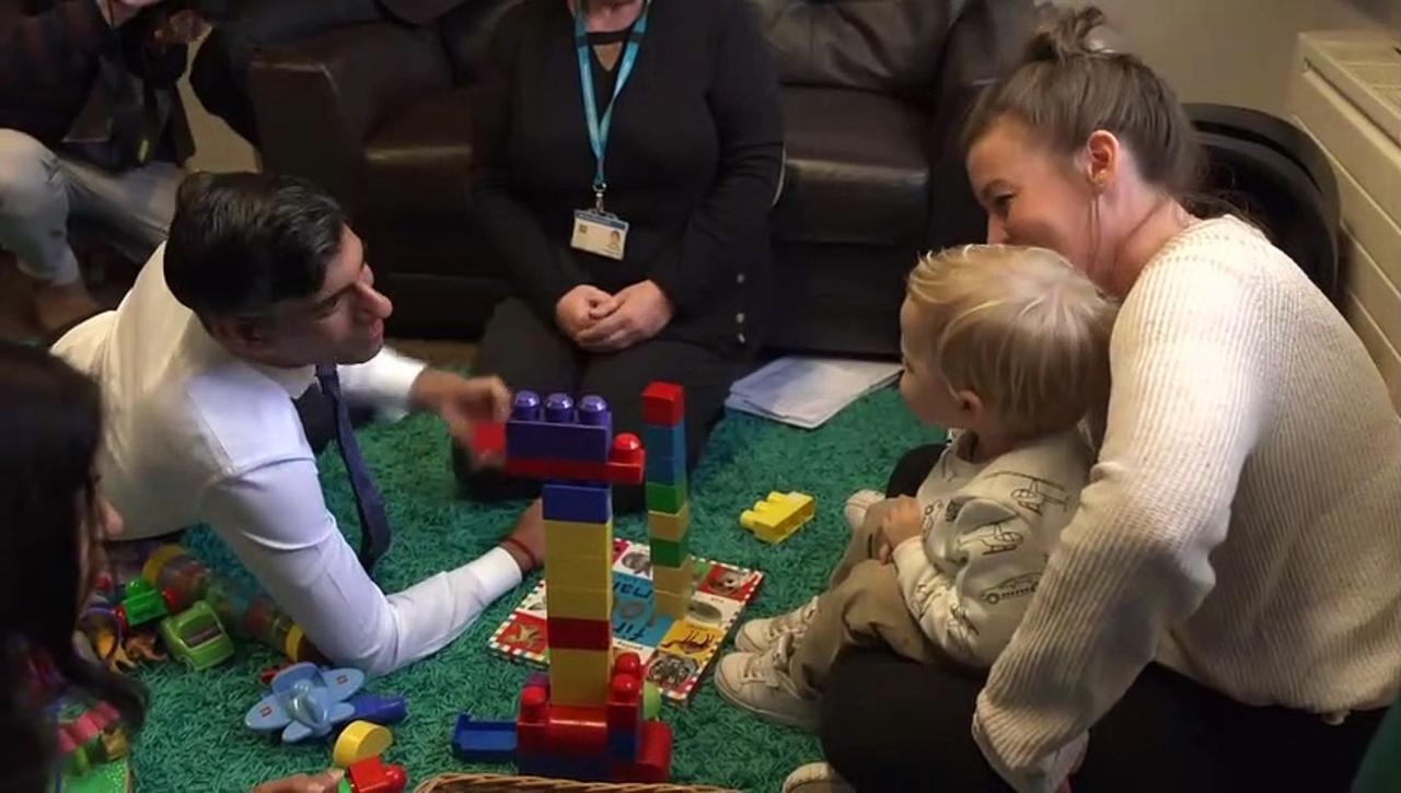 PM builds tower with toddler during family hub visit with wife