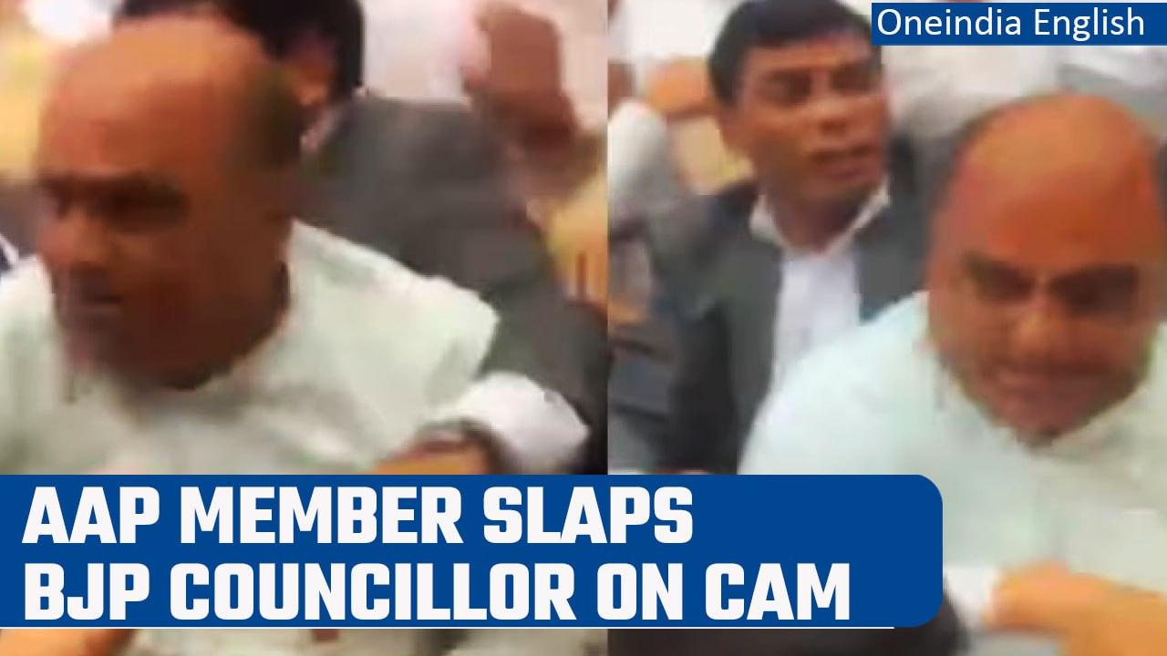 AAP councillor slaps BJP leader Pramod Gupta during chaos in MCD House | Watch | Oneindia News