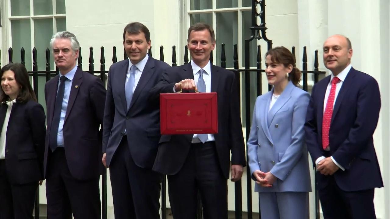 Jeremy Hunt poses with Budget box as he heads to Parliament