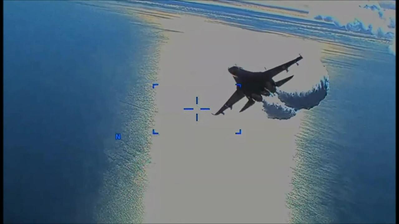 Russian Su-27 fighter jet dumps fuel on and then in second pass, collides with US drone.