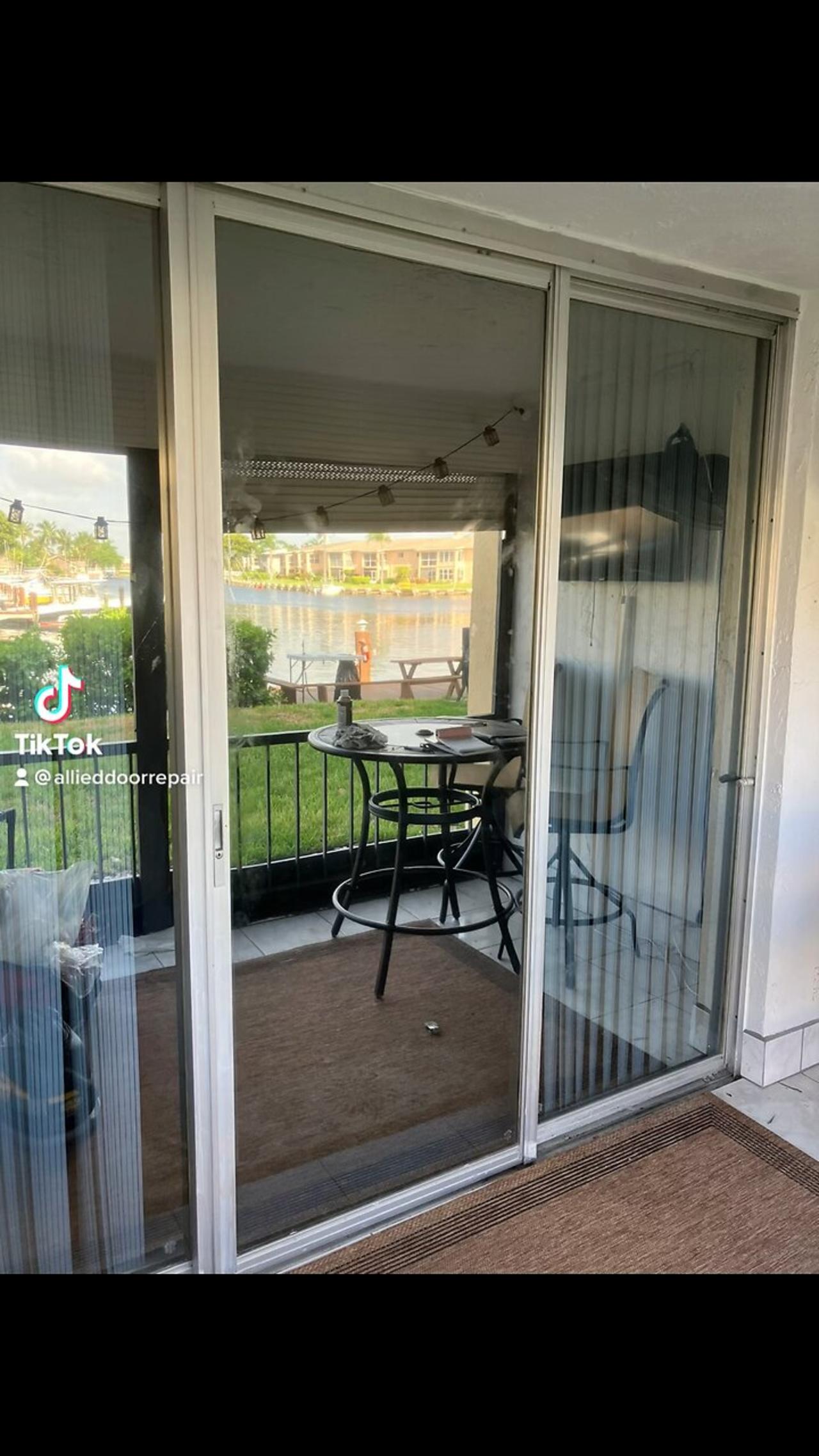 Sliding glass door repair; roller and track replacement, in Pompano Beach, Fl.