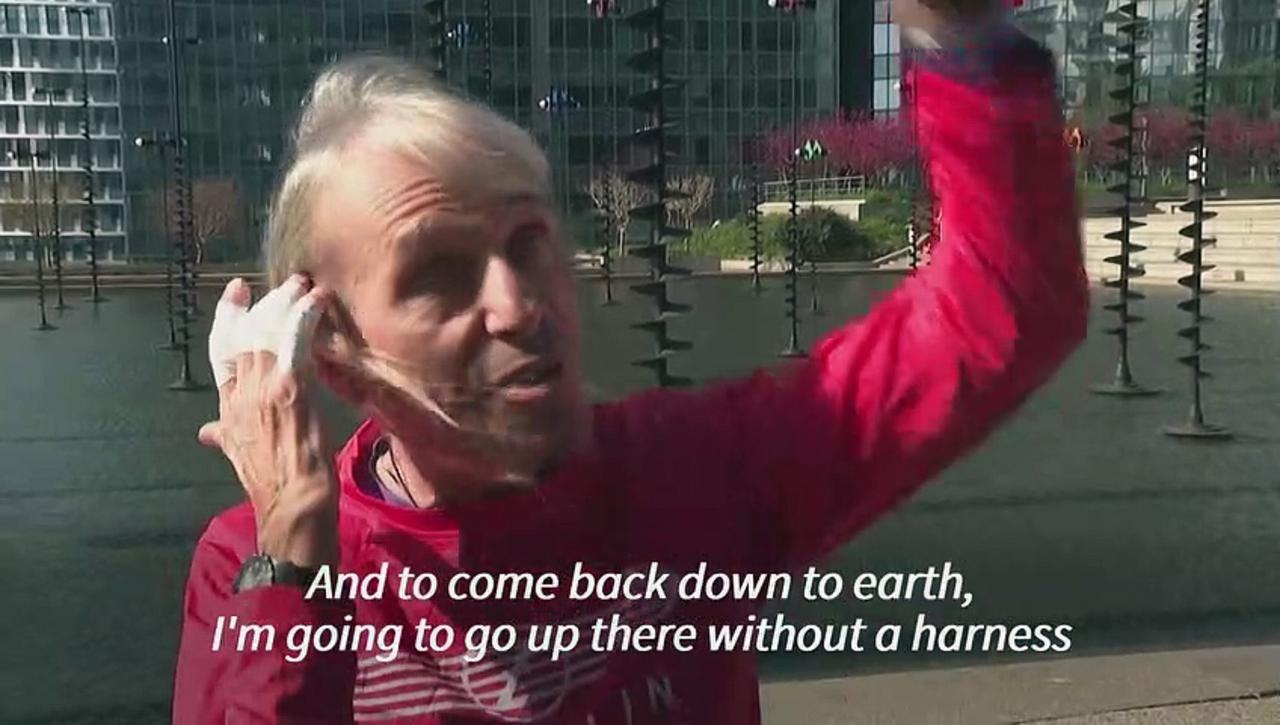 'French Spiderman' Alain Robert climbs skyscraper to protest pension reform