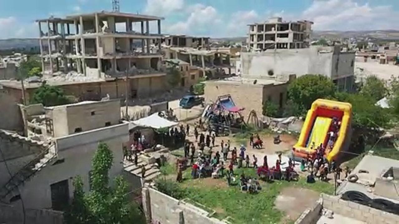 Syrian children celebrate Eid at makeshift amusement park amid quake rubble