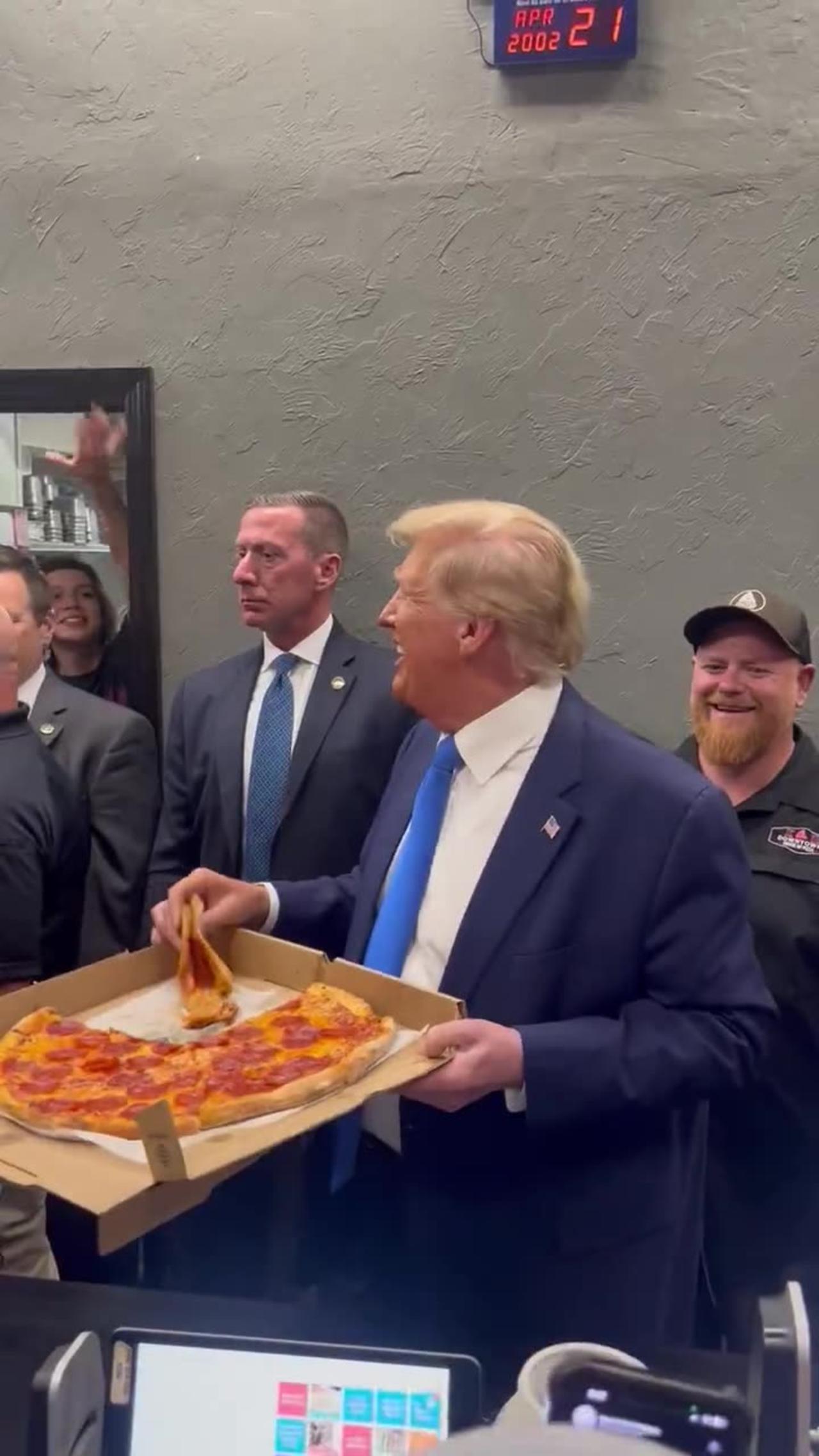 Trump Shows Off His Charisma, Hands Out Pizza To Supporters