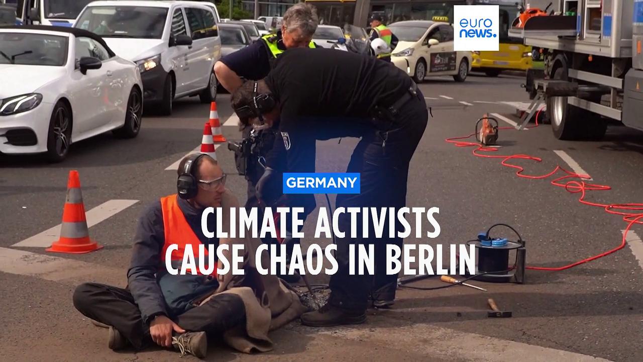 Police use drill to free activist's hand during climate protest in Germany