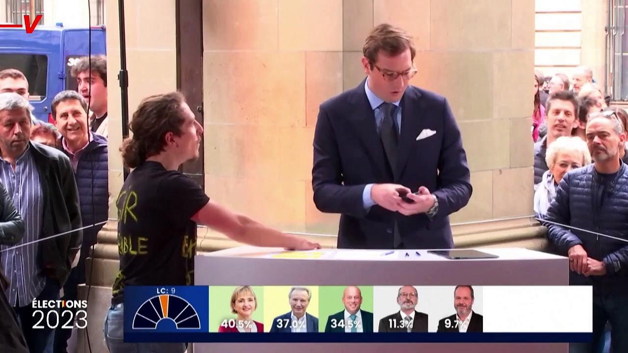 Climate Activist Glues Hand to Podium During Swiss Election