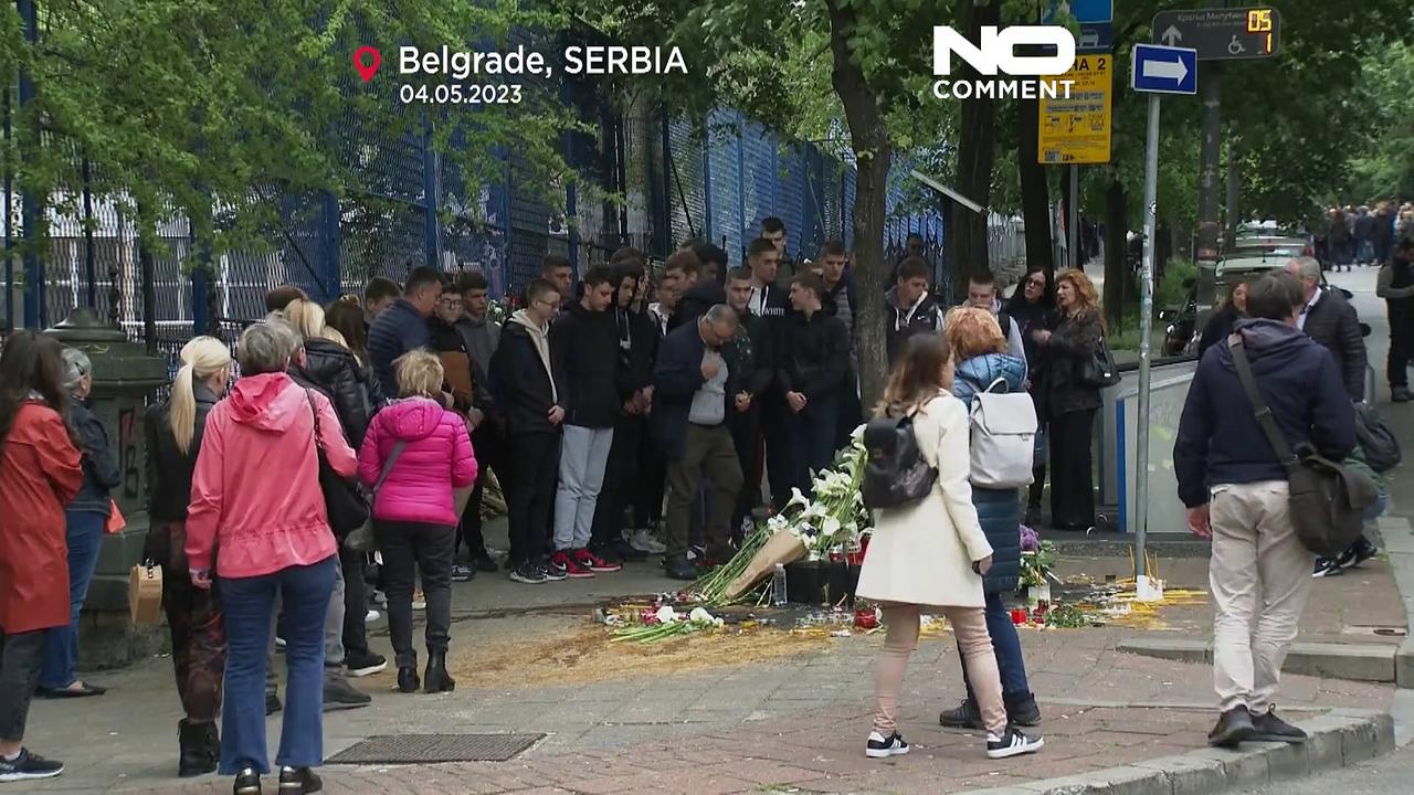 WATCH: Belgrade residents light candles and lay flowers in honour of school shooting victims