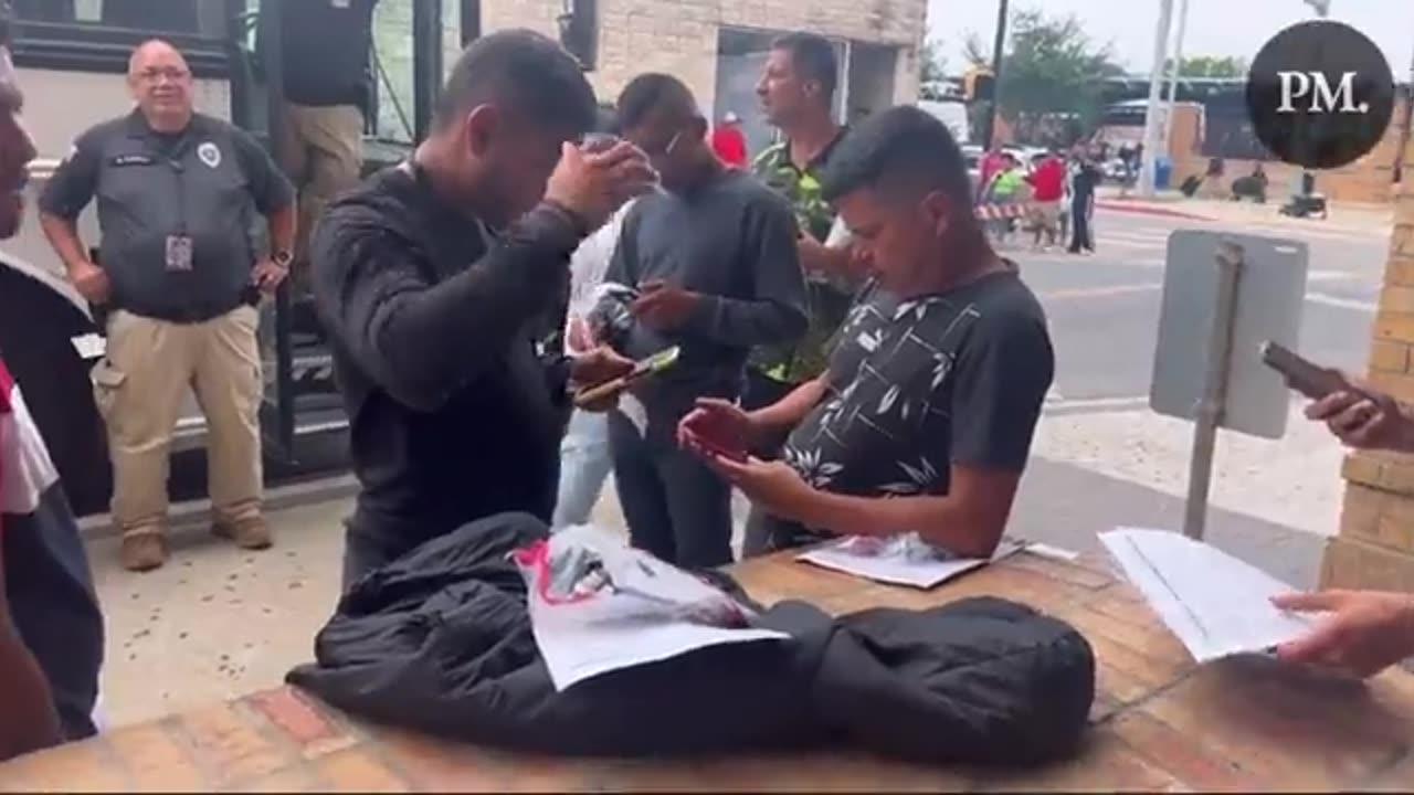 Illegals in Brownsville, Texas opening their new cellphones from DHS.