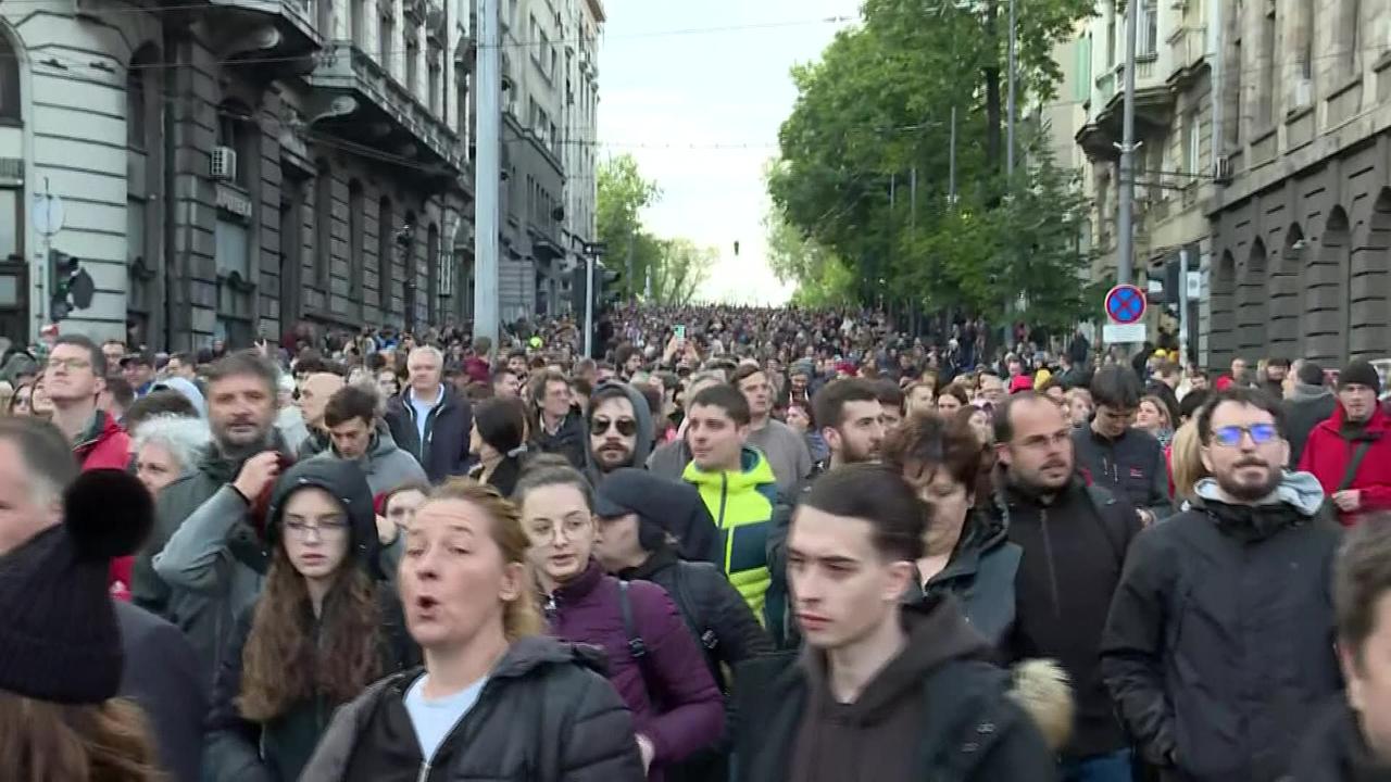 Thousands march in Belgrade following mass shootings