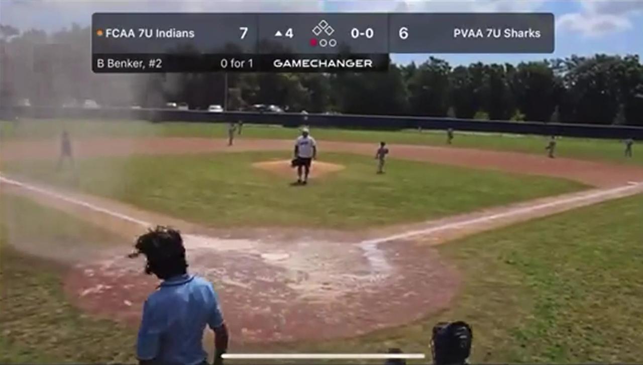 Dust Devil Engulfs Catcher at Little League Baseball Game