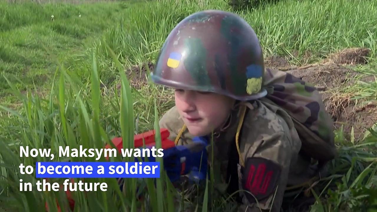 'Playing war': Conflict militarises Ukrainian children